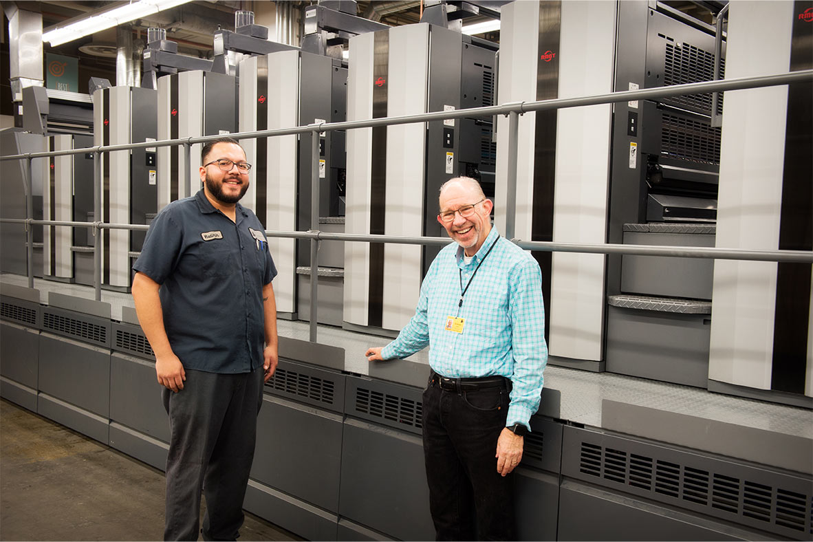 Lithographix President Ed Binder (right) with First Pressman Vladimir Salgado